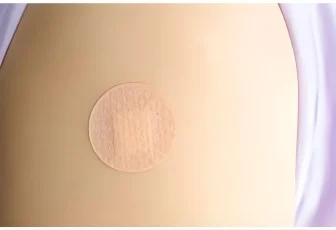 IMS CGM+ wearable sensor patch worn on the upper arm